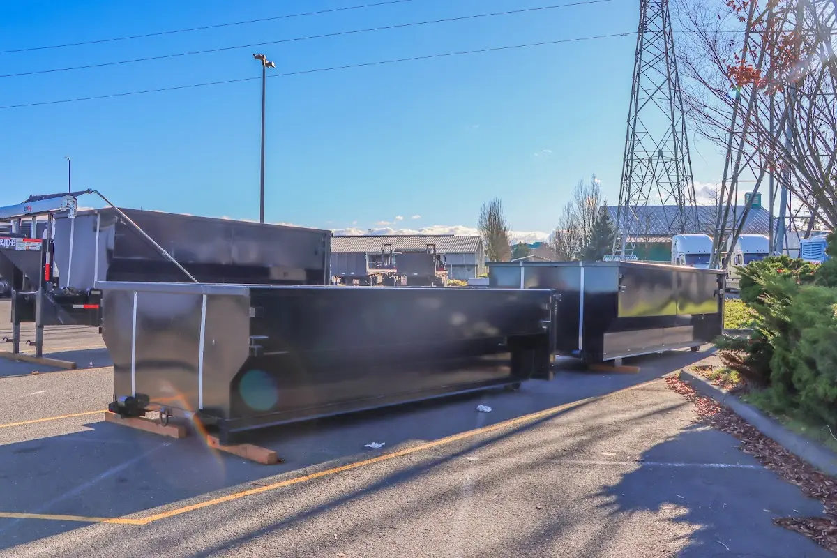 Roll-off dumpster ready for waste disposal at job site for 6 Yard Dumpster Rental in Boston
